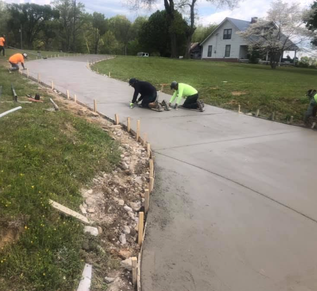 Hand-finishing a wide residential drive — concrete work by Williams Concrete Services in Gallatin, TN
