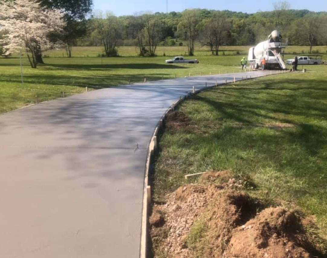 Long curved driveway, fresh off the truck — concrete work by Williams Concrete Services in Sumner County, TN